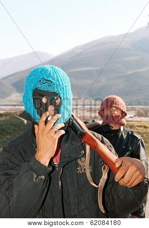BALSH, ALBANIA, 15 MARCH 1997 - Albanian militiamen hold a piece of road linking Albania's south with Tirana. Anarchy broke out in the troubled Balkan nation after pyramid schemes collapsed