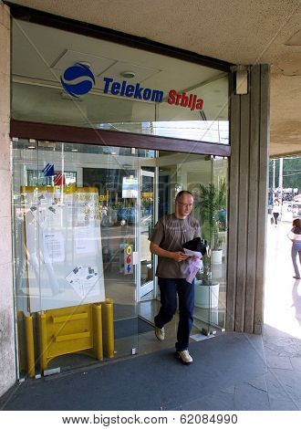 BELGRADE, YUGOSLAVIA, 25 JUNE 2003 A customer exits a Telekom Serbia office in  Belgrade. Serbia, on June 25, 2003. The former state telecom monopoly was privatized in 1999.