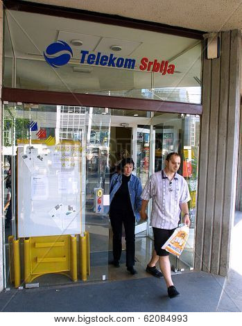 BELGRADE, YUGOSLAVIA, 25 JUNE 2003 A customer exits a Telekom Serbia office in  Belgrade. Serbia, on June 25, 2003. The former state telecom monopoly was privatized in 1999.