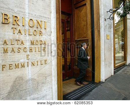 ROME - MARCH 13:  Luxury shopping along Via Condotti in Rome, Italy, on March 13, 2005. A sales clerk stands in front of a Brioni clothing salon.