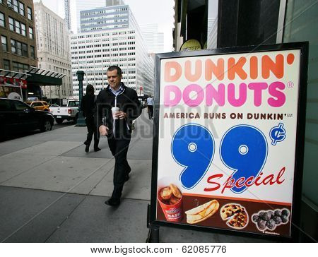 NEW YORK CITY - APRIL 19: A man walks out from a Dunkin' Donuts franchise in New York City, on Friday, April 19, 2013.