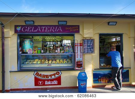 MONTEROSSO - ITALY: AUG 17: A man orders ice cream from a gelato stand along the coast of Cinque Terre in Monterosso, Italy, on Sunday, August 17, 2013. 