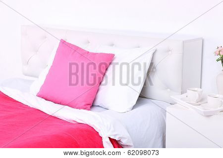 Comfortable soft bed with pillows