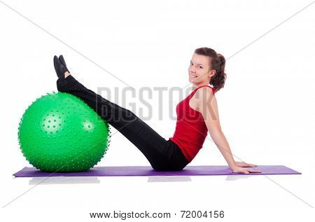 Young woman exercising with swiss ball