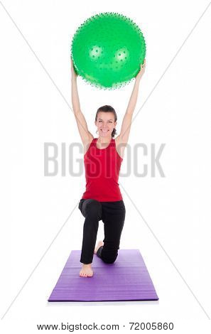 Young woman exercising with swiss ball
