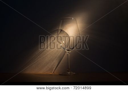 large glass of red wine on dark background