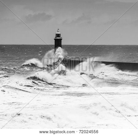 Powerful Waves Crash Over Lighthouse