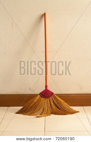 Broom Leaning On The Old Gray Wall
