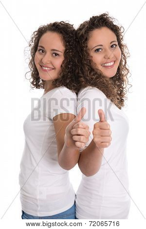 Smiling isolated girls with thumbs up: real twins.