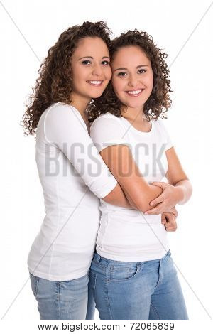Real twin sisters: Portrait of two smiling isolated young woman with natural curls.