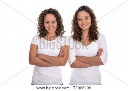 Real twin sisters: Portrait of two smiling isolated young woman with natural curls.