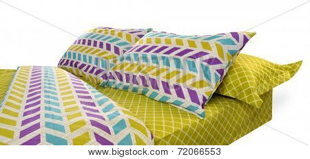 Bed covered with bed spreads and soft pillow.