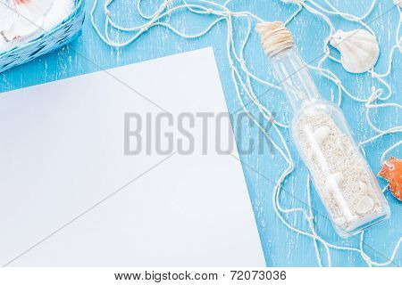 Glass Bottle With Sand And Blank Piece Of Paper