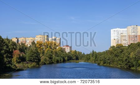 City landscape. Houses on river banks