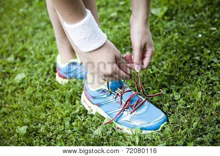 Two Young Girls Stetching Before A Jogging