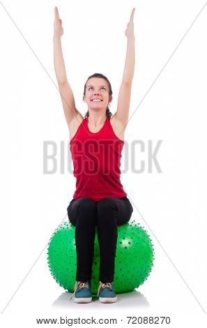Young woman exercising with swiss ball