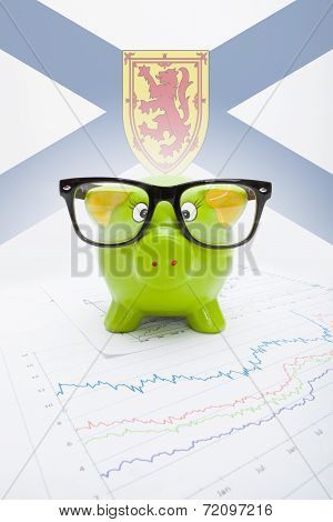 Piggy Bank With Canadian Province Flag On Background - Nova Scotia