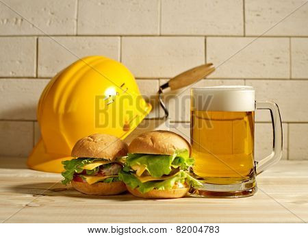 Beer And Burgers With The Helmet Against A Brick Wall