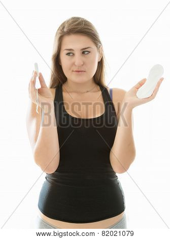 Cute Woman In Lingerie Holding Tampon And Menstrual Pad