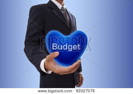 Businessman hand holding blue heart bubble