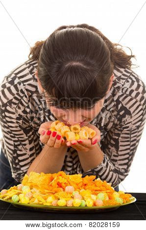 young girl overeating junk food