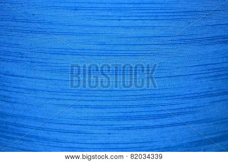 The texture of a material with blue stripes