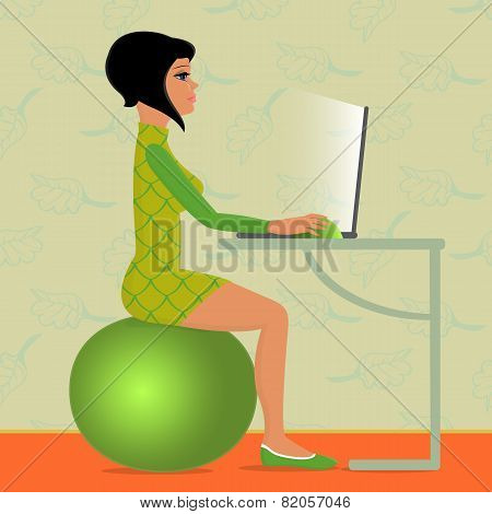 young woman sitting on fitness ball