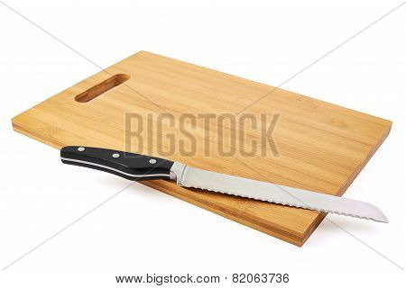 Steel kitchen knife on cutting board