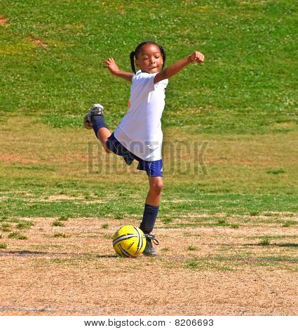 Girl's Soccer Kicking The Ball