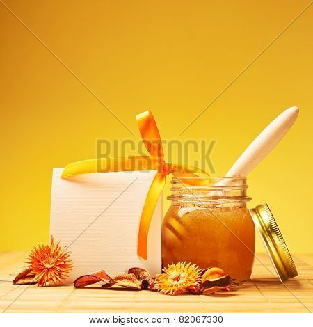 Honey jar and empty white card composition