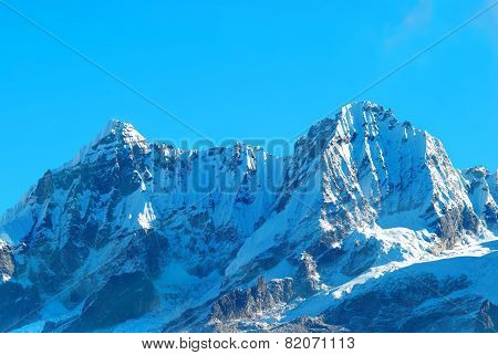 High Mountains Covered By Snow