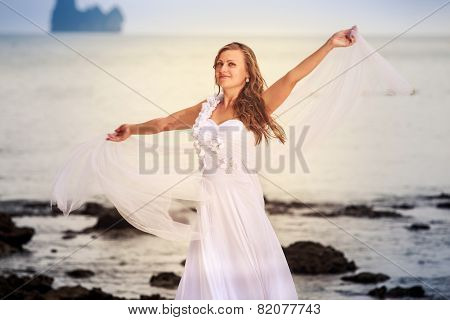 Bride Whirls On Sandy Beach