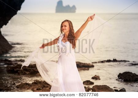 Bride Whirls On Sandy Beach