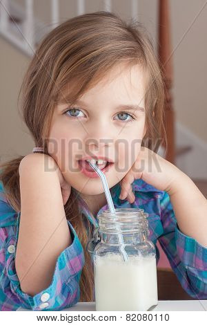 little girl drinking milk