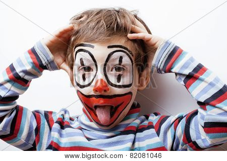 little cute real boy with facepaint like clown, pantomimic expre