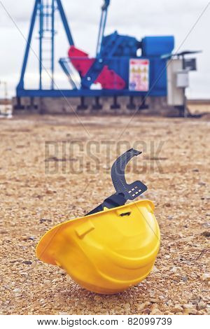 Pumpjack Oil Pump And Protective Helmet