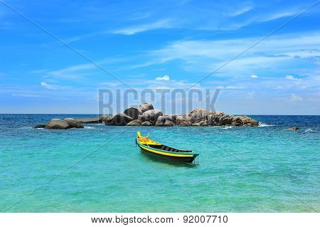 Yellow boat in the turquoise sea