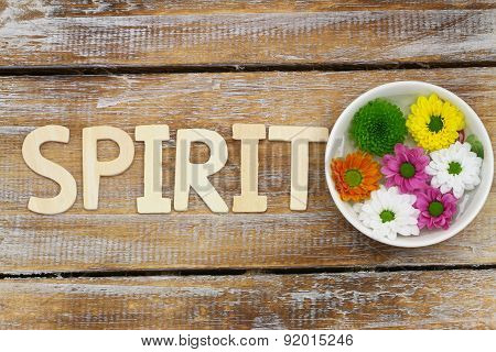Spirit written with wooden letters and Santini flowers