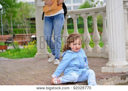 Naughty Girl 2 Years Old Sitting On Ground