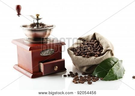 Sack Full Of Coffee Beans With Green Leaves With Mill