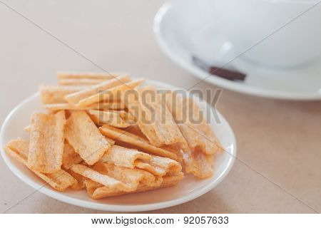 Snack On White Plate With Coffee Cup