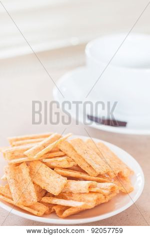 Snack On White Plate With Coffee Cup