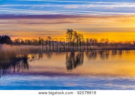 Sunset In Zinnowitz With Reflection On The Water