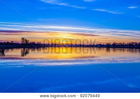 Sunset In Zinnowitz With Reflection On The Water
