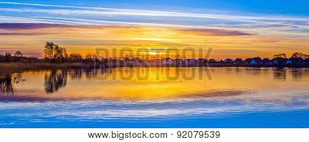 Sunset In Zinnowitz With Reflection On The Water