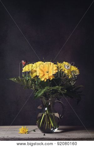 Bouquet Of Flowers On A Table With Butterflies And Fly