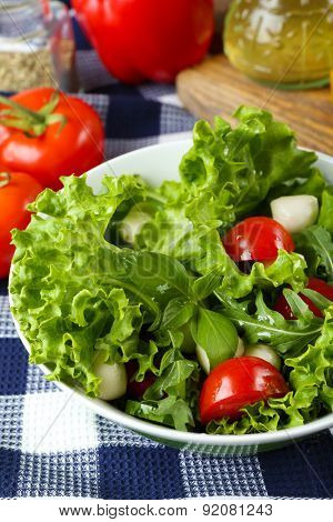 fresh vegetable salad in bowl on table close up