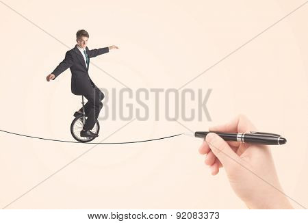 Businessman riding monocycle on a rope drawn by hand concept