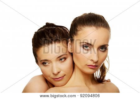 Two attractive sisters with make up.