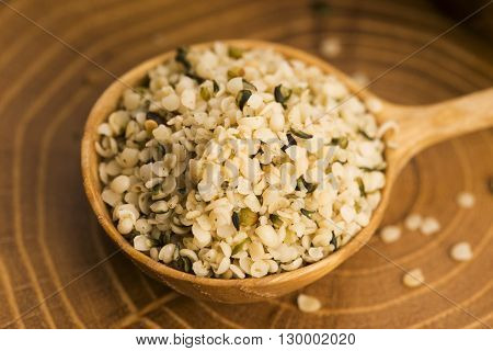 Shelled Hemp Seeds On Wood Background